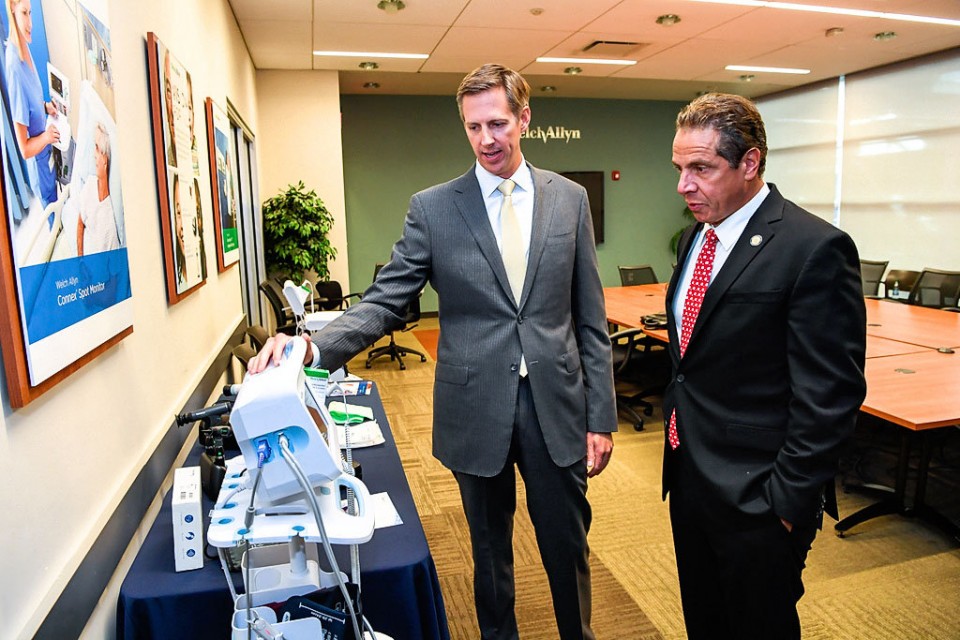 Welch Allyn President Alton Shader shows New York Gov. Andrew Cuomo a display of the company's medical device products at the company's headquarters in Skaneateles on Wednesday, Sept. 28. from Syracuse.com
