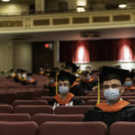 Candidates listen as UR president Sarah C Mangelsdorf makes remarks. // Master’s degree commencement ceremony, Kodak Hall at Eastman Theatre May 22, 2021. // photo by J. Adam Fenster / University of Rochester